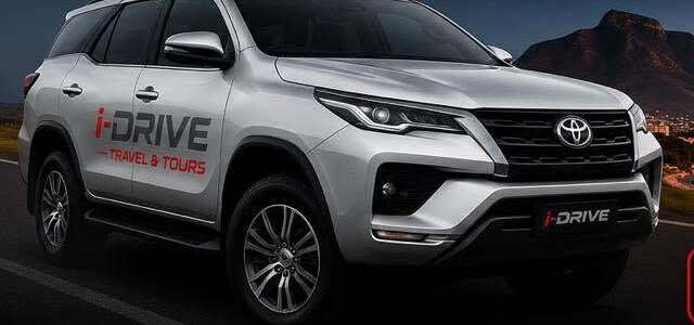 An i-Drive Toyota Fortuner with Table Mountain in the background